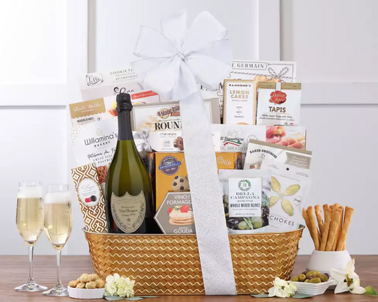 Gift basket with Dom Perignon champagne, snacks in a gold metal container Gift basket with Dom Perignon champagne, snacks in a gold metal container