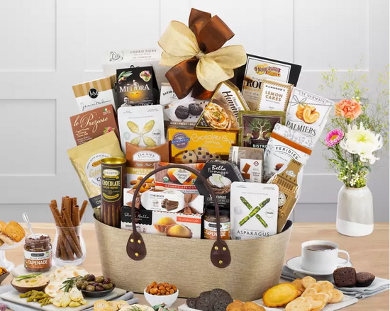 Large gourmet gift basket with various food items in a beige fabric container Large gourmet gift basket with various food items in a beige fabric container