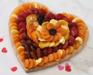 Heart-shaped dried fruit platter with dried fruits Heart-shaped dried fruit platter with dried fruits