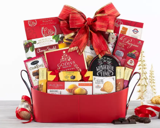 Gift basket with a red bow filled with various snacks