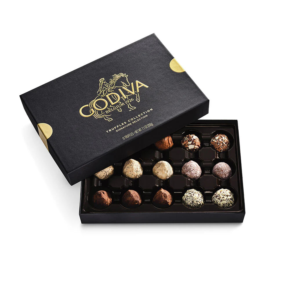 Open Godiva chocolate box with truffles o