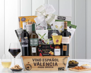 Gourmet gift basket with wine, snacks,