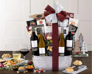 Gourmet gift basket with wine, cheese, and snacks