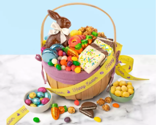 Easter basket filled with candy and treats on a white surface with a light blue background