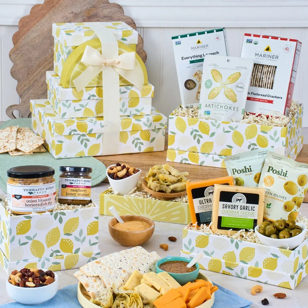 Assorted food items and packaging on a table with lemon-themed boxes.