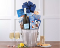 Stainless steel ice bucket with champagne, snacks, and a blue bow
