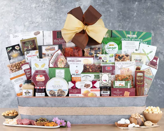 Gourmet gift basket with various food items in a metal container Gourmet gift basket with various food items in a metal container