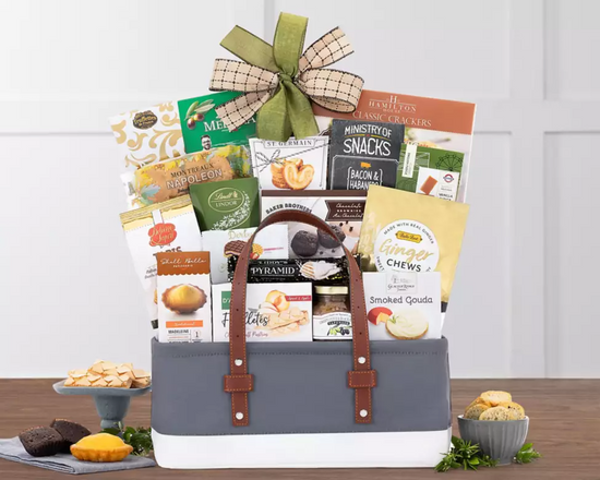 Gift basket with snacks and treats in a fabric container Gift basket with snacks and treats in a fabric container
