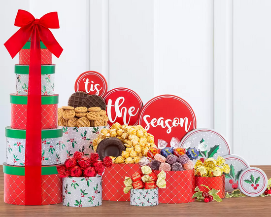 Decorative holiday gift tower with colorful boxes and delicious snacks Decorative holiday gift tower with colorful boxes and delicious snacks