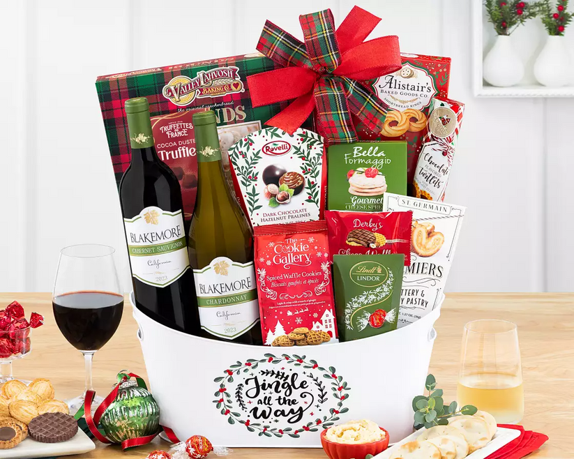 Gift basket with red and white wine, snacks, and holiday snacks