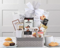 Grey fabric basket with coffees, cookies and white ceramic mug