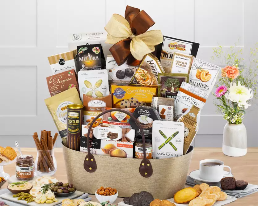 Large gourmet gift basket with various food items in a beige fabric container