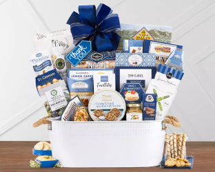 Thank you Gift basket with various products including snacks and a blue bow 