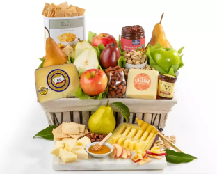 Gourmet gift basket with fruits, cheese, and other snacks 
