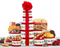 Decorative gift tower with fruits, nuts, and candies 