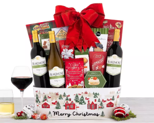 Gift basket with wine bottles, snacks, and a red bow labeled 'Merry Christmas'