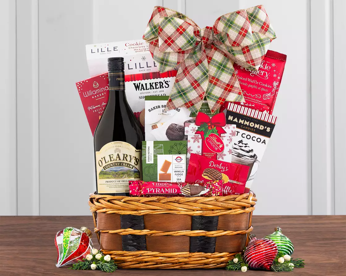Gift basket with a bottle of alcohol, snacks, and a plaid bow
