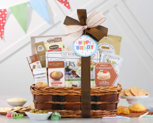 Gift basket with baby items on a table with a colorful banner 