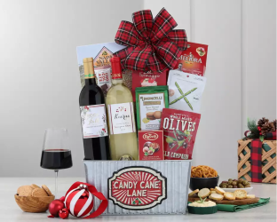 Gourmet gift basket with wine, snacks, and a plaid bow 
