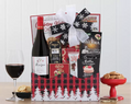 Gift basket with wine, snacks, and a bow