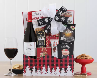 Gift basket with wine, snacks, and a bow