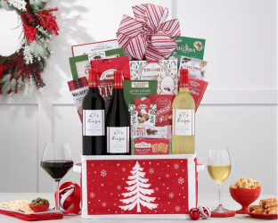 Gift basket with wine, snacks, and Christmas-themed treats