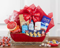 Gift basket with Lindt chocolate, candy, and a polar bear figurine 