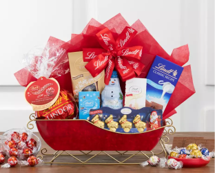 Gift basket with Lindt chocolate, candy, and a polar bear figurine 