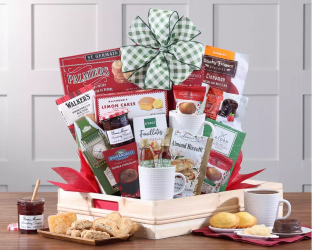 Gourmet breakfast gift basket with snacks and a coffee cup 