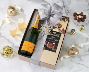 Bottle of champagne and a box of chocolates