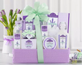 Gift basket with lavender-themed products including candles and soap bars,