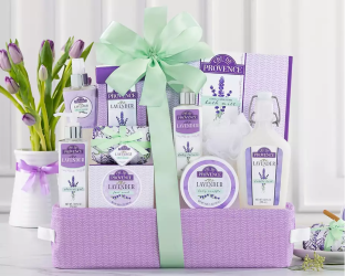Gift basket with lavender-themed products including candles and soap bars,