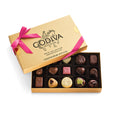 Godiva chocolate box with a pink ribbon on a white background