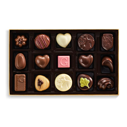 Assorted chocolates in a box on a white background