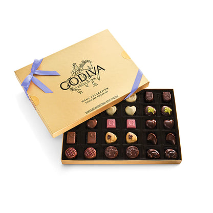 Godiva chocolate box with a variety of chocolates on a white background
