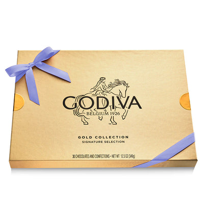 Godiva Gold Collection chocolate box with a purple ribbon on a white background