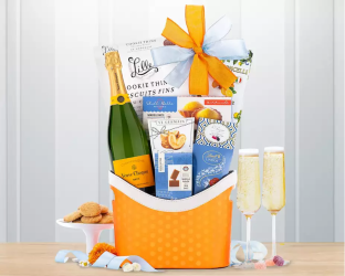 Gift basket with champagne, cookies, and snacks 