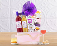 Gourmet gift basket with wine, cheese, and snacks 