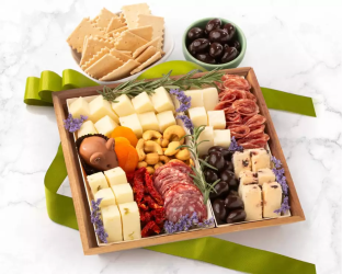 Assorted charcuterie board with meats, cheeses, and fruits