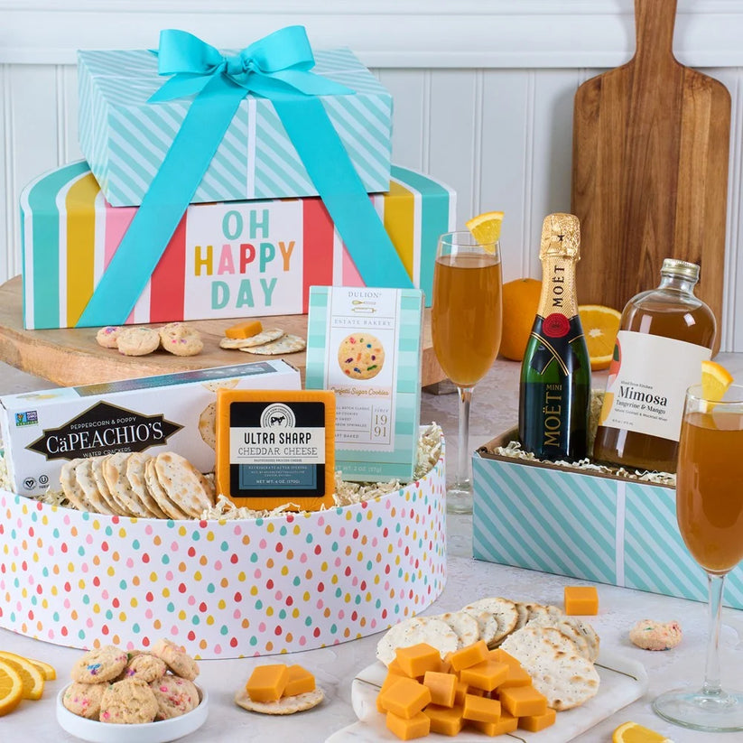 Gift basket with snacks, drinks, and a bottle of champagne 