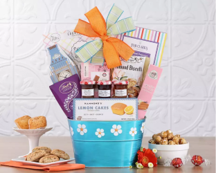 Gift basket with various items including cookies, candies, and a blue container
