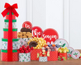 Decorative holiday gift tower with colorful boxes and delicious snacks